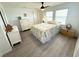 Cozy bedroom with a comfortable bed, dresser, and ample natural light at 177 Palm Harbor Dr, North Port, FL 34287