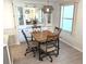 Dining room area with built-in display cabinet and lots of natural light at 177 Palm Harbor Dr, North Port, FL 34287