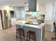 Beautiful kitchen with white cabinets, marble countertops and stainless steel appliances at 177 Palm Harbor Dr, North Port, FL 34287