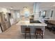 Bright kitchen with white cabinets, marble countertops and stainless steel appliances at 177 Palm Harbor Dr, North Port, FL 34287