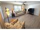 Inviting living room features neutral colors, vinyl floors and a ceiling fan at 177 Palm Harbor Dr, North Port, FL 34287