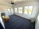 Bright sun room with plenty of natural light, a ceiling fan, and access to the outdoors at 177 Palm Harbor Dr, North Port, FL 34287