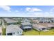 Aerial view showcasing a neighborhood with many single-Gathering homes and lush landscaping at 18001 Grand Prosperity Dr, Venice, FL 34293