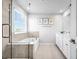 Bright bathroom with a tub, glass-enclosed shower, and a double vanity with ample counter space at 18001 Grand Prosperity Dr, Venice, FL 34293