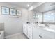 Bathroom featuring a double vanity, and decor for a clean, spa-like experience at 18001 Grand Prosperity Dr, Venice, FL 34293