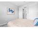Neutral bedroom with a bed, minimalist art and decor, offering a tranquil, relaxing atmosphere at 18001 Grand Prosperity Dr, Venice, FL 34293