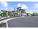 Luxurious clubhouse exterior with sleek design, modern architecture and lush landscaping at 18001 Grand Prosperity Dr, Venice, FL 34293