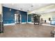 Fitness center features ample workout space, mirrored walls, and plenty of colorful free weights at 18001 Grand Prosperity Dr, Venice, FL 34293
