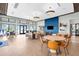 Comfortable clubhouse lounge area with contemporary furniture and scenic outdoor views at 18001 Grand Prosperity Dr, Venice, FL 34293