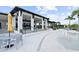 Resort-style pool with elegant seating and umbrellas at clubhouse at 18001 Grand Prosperity Dr, Venice, FL 34293