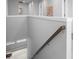 Contemporary staircase with neutral wall color and natural light, for a modern home interior at 18001 Grand Prosperity Dr, Venice, FL 34293