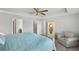 Spacious main bedroom with a sitting area, en suite bathroom and walk-in closet at 1843 Oakland Rd, North Port, FL 34286