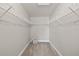Empty walk-in closet with shelving ready for customization at 1843 Oakland Rd, North Port, FL 34286