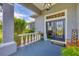 Inviting front porch with double doors and stylish decor creates a warm welcome to the home at 2000 Jasmine Way, North Port, FL 34287