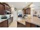Well-equipped kitchen with stainless steel appliances, tile backsplash, granite counters, and ample cabinet space at 2000 Jasmine Way, North Port, FL 34287