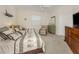 Comfortable bedroom featuring twin beds, accent pillows, and a neutral color scheme at 2022 Calusa Lakes Blvd, Nokomis, FL 34275