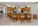 Charming kitchen features wooden cabinets, granite countertops, a ceiling fan, and tile floors at 2022 Calusa Lakes Blvd, Nokomis, FL 34275