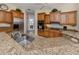 Granite countertops highlight this updated kitchen with modern stainless steel appliances and lots of light at 2022 Calusa Lakes Blvd, Nokomis, FL 34275