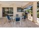 Covered patio with a dining table, chairs, and built-in outdoor grill at 2022 Calusa Lakes Blvd, Nokomis, FL 34275