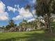 Beautiful community waterfall feature with lush greenery and palm trees at 2022 Calusa Lakes Blvd, Nokomis, FL 34275