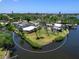 Wonderful waterfront property with mature landscaping offers access to a bay for boating and relaxation at 214 Pompano Ln, Nokomis, FL 34275