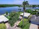 Great waterfront location with tropical trees, lush lawn, and easy access to a bay offers a serene retreat at 214 Pompano Ln, Nokomis, FL 34275