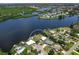 Beautiful aerial view of the property showing its waterfront location and surrounding community at 214 Pompano Ln, Nokomis, FL 34275