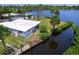 Nice single Gathering home on the water with a dock, mature landscaping and easy access to the bay for boating at 214 Pompano Ln, Nokomis, FL 34275