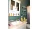 Bathroom featuring vanity with granite counter-top, storage cabinet and shelving at 2682 Yamada Ln, North Port, FL 34286