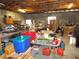 Garage space with contents on table with red and blue storage containers at 2682 Yamada Ln, North Port, FL 34286
