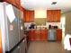 Spacious kitchen featuring stainless appliances, granite counters and wood cabinets at 2682 Yamada Ln, North Port, FL 34286