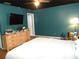 Cozy main bedroom with hardwood floors, a dresser, and natural light at 2682 Yamada Ln, North Port, FL 34286