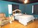 Comfortable main bedroom featuring hardwood floors, chair, and natural light at 2682 Yamada Ln, North Port, FL 34286