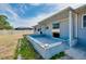 A backyard view shows the covered porch area and the fenced property line at 2980 Siesta Dr, Venice, FL 34293
