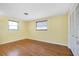 Bedroom with wood floors, blinds and large closet at 2980 Siesta Dr, Venice, FL 34293