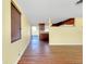 Inviting living room with hardwood floors and a view of the kitchen and outdoor patio at 2980 Siesta Dr, Venice, FL 34293