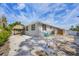 Exterior view of backyard with tiki hut, offering an inviting outdoor space for relaxation and entertainment at 307 Bucknell Rd, Venice, FL 34293