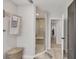 Bright bathroom featuring a glass walk-in shower and view to the hall at 307 Bucknell Rd, Venice, FL 34293