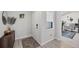 Entryway with a wooden dresser, stylish rug, and an open view into an office at 307 Bucknell Rd, Venice, FL 34293