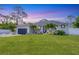 Charming single Gathering home with a well-maintained lawn and tropical landscaping at 307 Bucknell Rd, Venice, FL 34293