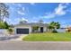 Well-maintained single Gathering home with an attached garage and landscaping at 307 Bucknell Rd, Venice, FL 34293