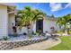 Close up of front door with landscaping featuring rocks and block at 307 Bucknell Rd, Venice, FL 34293