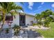 Close up of front door with landscaping featuring rocks and block at 307 Bucknell Rd, Venice, FL 34293