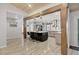 Modern kitchen with an island, bar seating, stainless steel appliances, and wooden beam at 307 Bucknell Rd, Venice, FL 34293