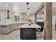 Well-lit kitchen featuring an island, modern appliances, and bright countertops at 307 Bucknell Rd, Venice, FL 34293