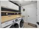Well-organized laundry room with modern appliances, ample counter space, and stylish design at 307 Bucknell Rd, Venice, FL 34293