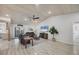 Bright living room with vaulted ceiling, neutral paint, and light wood vinyl flooring at 307 Bucknell Rd, Venice, FL 34293