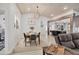 Open living area with modern decor, wood floors, dining area, and an open kitchen at 307 Bucknell Rd, Venice, FL 34293