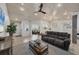Inviting living room with modern decor, wood ceilings and open layout perfect for entertaining at 307 Bucknell Rd, Venice, FL 34293