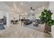 Bright living room with plank tile flooring, modern furnishings, and open concept design at 307 Bucknell Rd, Venice, FL 34293